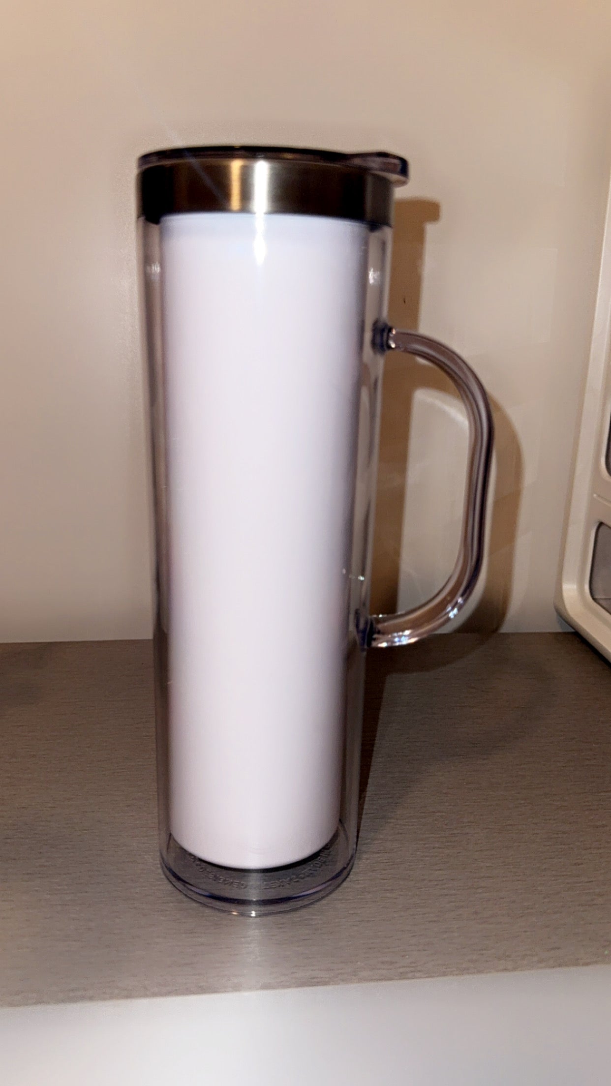 20oz Stainless Steel Snow Globe tumbler with handle.